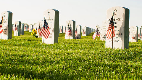 Denver, Colorado-May 28, 2012: Endless row of white marble gravestones continues above hilltop at the Fort Logan National Cemetery in Denver, Colorado.