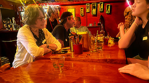 People speak over food and drinks at Mission Cantina.