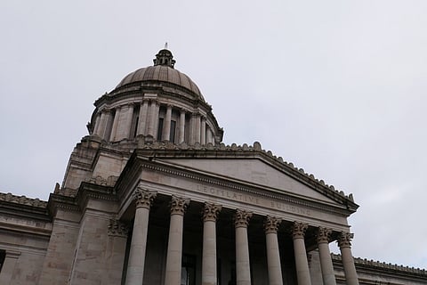 Exterior roof of WA state Capitol building on a cloudy day.