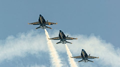 Three Blue Angels fly during a performance.