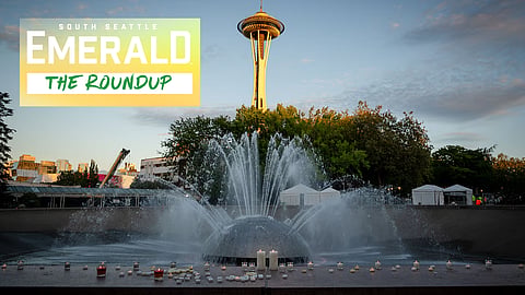 Candles line the International Fountain at Seattle Center on July 27, 2026, during a silent vigil honoring the three people killed in a shooting at the Bite of Seattle the previous day.
