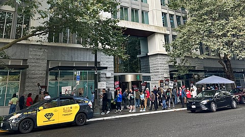 Embassy Suites workers and their allies picket at Embassy Suites by Hilton on a day when the Sounders played.