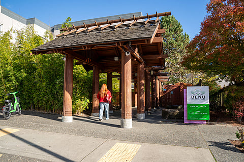 A person walks through the entrance of BENU Community Home.