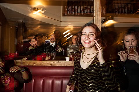 Attendees of the 2nd Annual Midnight Mecca New Year's Eve Ball sing happy birthday to Mnica Mendoza-Castrejn on December 31, 2016 at the Black & Tan Hall in Hillman City. The ball, which centered Seattle's queer and trans people of color, was also Black & Tan Hall's grand opening celebration.