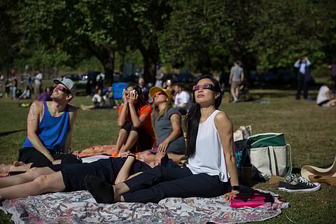 People witnessing a solar eclipse in Seward Park in 2017. (Photo: Alex Garland)