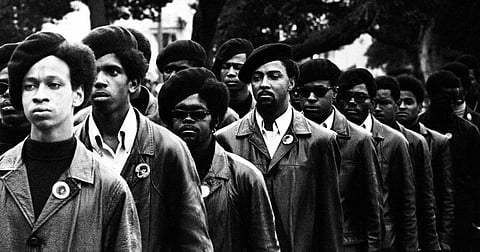 July 28, 1968 - Oakland, California, USA: "Panthers on Parade" Panthers line up at a Free Huey rally in DeFremery Park, in west Oakland's ghetto. Light skinned man is Gregory Harrison. His brother, Oleander, went to Sacramento with Bobby Seale. (Stephen Shames/Polaris)
On October 28, 1967, Oakland police officer John Frey was shot to death in an altercation with Huey P. Newton during a traffic stop. In the stop, Newton and backup officer Herbert Heanes also suffered gunshot wounds. Newton was convicted of voluntary manslaughter at trial, but the conviction was later overturned. At the time, Newton claimed that he had been falsely accused, leading to the "Free Huey" campaign. This incident gained the party even wider recognition by the radical American left. Newton was released after three years, when his conviction was reversed on appeal.
As Newton awaited trial, the Black Panther party's "Free Huey" campaign developed alliances with numerous individuals, students and anti-war activists, "advancing an anti-imperialist political ideology that linked the oppression of antiwar protestors to the oppression of blacks and Vietnamese".The "Free Huey" campaign attracted black power organizations, New Left groups, and other activist groups. The Black Panther Party collaborated with the Peace and Freedom Party, which sought to promote a strong antiwar and antiracist politics in opposition to the establishment democratic party. The Black Panther Party provided needed legitimacy to the Peace and Freedom Party's racial politics and in return received invaluable support for the "Free Huey" campaign.
The Black Panther Party was one of the most influential responses to racism and inequality in American history. The Panthers advocated armed self-defense to counter police brutality, and initiated a program of patrolling the police with guns and law books. Their enduring legacy is their programs, like Free Breakfast for Children, which helped to inspire a national movement of com