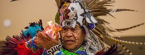 Juan Salinas performs the only ceremony the Aztec culture is allowed to share with those outside the culture, during the fifth annual celebration of Indigenous People's Day at Daybreak Star Indian Cultural Center in Seattle, Washington, on Oct. 8, 2018. He belongs to Tloke Nahuake- tlayolohtli, a traditional Aztec Fire Dance family group. (Photo: Carolyn Bick}