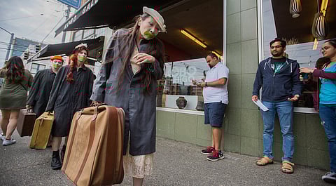 Butoh performers enact a suitcase walk, to demonstrate the forced internment of Japanese-Americans in WWII, during the third annual "Hai! Japantown" summer festival in Seattle, Washington, on Aug. 17, 2019. (Photo: Carolyn Bick)