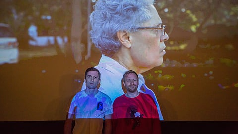 Casey Moore, left, and Tommy Swenson, right, pose for a photograph in front of the film, "The Sandinistas," playing at The Beacon Cinema in Seattle, Washington, on Aug. 25, 2019. (Photo: Carolyn Bick)