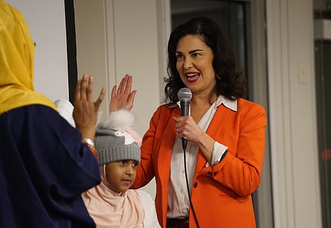 Tammy Morales is sworn in by Farhiya Mohamed, Executive Director of the Somali Family Safety Task Force, during a community swearing in ceremony at Centilia Cultural Center at El Centro de la Raz. (Photo: Susan Fried)