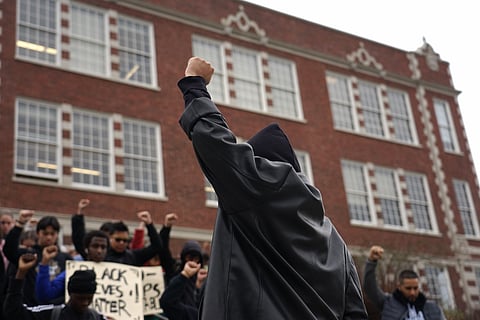 The Garfield High School Black Student Union leads a moment of silence for Trayvon Martin and his family on December 17, 2019 in Seattle, WA