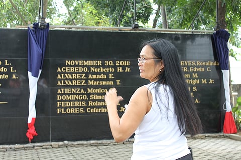 Cindy Domingo at the Bantayog ng mga Bayani (Wall of Martyrs), 2011, Quezon City, Philippines, in front of her brother Silme Domingo's name. He and Gene Viernes were the first Americans to be recognized on the Wall honoring the political victims of the Marcos Regime. (Photo: Sharon Maeda)
Cindy Domingo at the Wall of Martyrs, where her brother, Silme and Gene Viernes were the first victims of the Marcos dictatorship outside of the Philippines.