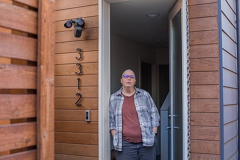 Brandi Soggs poses for a portrait in her doorway in Seattle, Washington, on April 14, 2020. (Photo: Carolyn Bick)