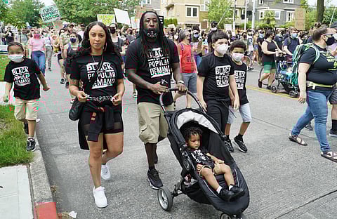 A family at a 2020 Seattle Juneteenth march. (Photo: Susan Fried)