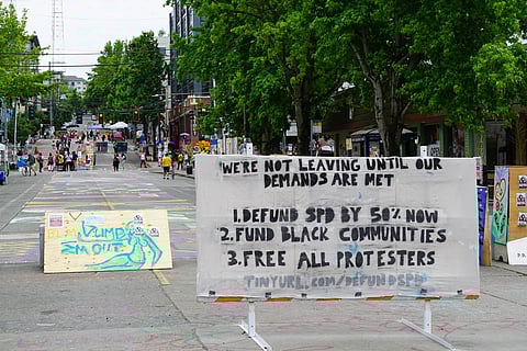 Sign listing protester demands at the Capitol Hill Occupied Protest zone in Seattle in 2020.