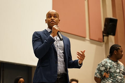 Girmay Zahilay, King County Council's newest member, addresses a crowd after being sworn in at Franklin High School