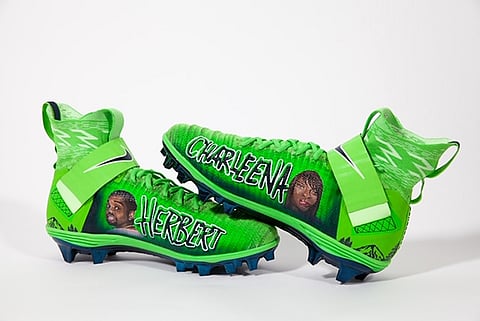 Seahawks' Russell Wilson Teams With Seattle Artist to Draw Attention to Police Shooting of Herbert Hightower Jr.