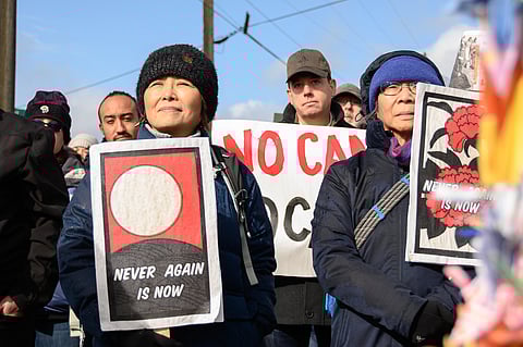 Protestors carry signs that read "Never Again Is Now"; Day of Remembrance 2020 Never Again (Photo: Sharon Ho Chang)