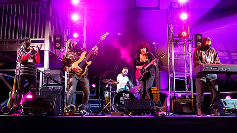 From left to right: The Walkers's mom on tambourine, bassist Ezekiel Lords, drummer Cedric Walker, frontwoman Eva Walker, and keyboardist Jake Uitti. (Photo: Danny Ngan)