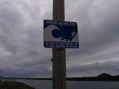 Tsunami Hazard Zone warning sign. Photo belongs to the public domain.