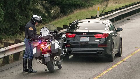 Washington State Patrol pulls over a car on I-5. Photo attributed to Avgeek Joe (under a Creative Commons ,CC BY-NC-ND 2.0 license).