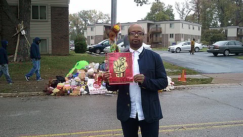 Tyrone Brown at the spot where Michael Brown was killed in 2014 in Ferguson, Missouri. Photo courtesy of Tyrone Brown.