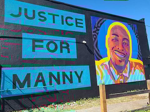 A mural honoring Manuel Ellis and calling for justice in his death fills a wall in Tacoma's Hilltop neighborhood. (Photo: KARI PLOG/KNKX)