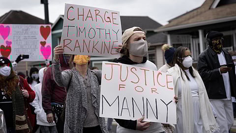 Protesters at a silent march in Tacoma on Sunday, Feb. 28, 2021, demanding justice for Manny Ellis, who was shot by police in March 2020. On Thursday, Attorney General Bob Ferguson announced the state would file charges against three officers involved in the shooting. (Photo: Ronnie Estoque)