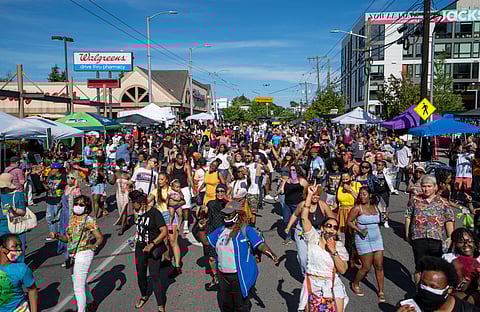 Hundreds of people danced the Electric Slide for 20 minutes during "Honoring Our Black Wall Streets," an event held on 23rd Avenue South and South Jackson Street on May 31, the 100th anniversary of the Tulsa Massacre. (Photo: Susan Fried)