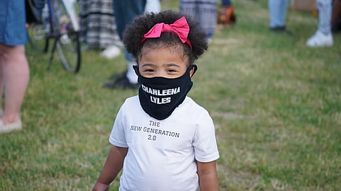 A young attendee at the Vigil of Remembrance for Charleena Lyles, June 18, 2020, at Magnuson Park. (Photo: Susan Fried)