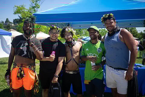 A group of Black masc queers pose for a photo at Taking B(l)ack Pride. (Photo: Chole Collyer)