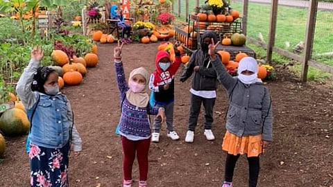 Young students at an after-school garden program at Hope Academy. Photo courtesy of African Community Housing & Development.