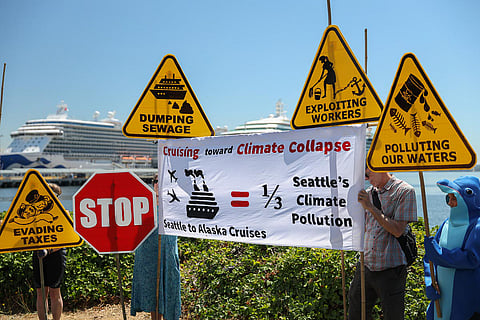 Local environmental advocates gather during a July 19, 2021, press conference held at Smith Cove Park to bring attention to pollution caused by cruise ships. (Photo: Alex Garland)
