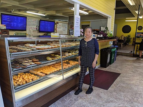 The Chhuor family owns and operates King Donuts with mother Kim Sok (pictured) working up to 14-hour days, often every day. (Photo: Mark Van Streefkerk)