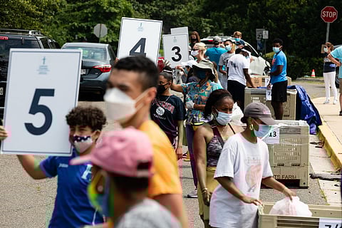 EcoLatino's participate in food distribution at Northwestern Highschool, providing coronavirus relief to Latino communities on July 17, 2020. Image attributed to the Chesapeke Bay Program (under a Creative Commons, CC BY-NC 2.0 license).