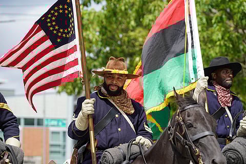 The Buffalo Soldiers of Seattle lead the 2021 Umoja Day of Unity Black Love Parade on Aug. 7, 2021. (Photo: Susan Fried)