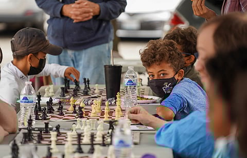 Detective Cookie's Chess Club member Yabi Ephrem, 11, plays a match during the Aug. 21 Chess Pop-Up at Detective Cookie Chess Park. (Photo: Susan Fried)