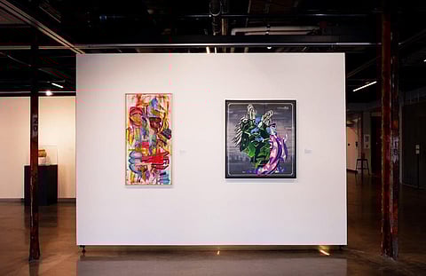 "Gallery View of In The City," Ahmed Davis. acrylic, 2020 (right) and "Deceiving the Gods," Jonathan Wakuda Fischer, spray-paint and stencils on Canvas, 2009 (left). Photo courtesy of Seattle Arts and Culture.