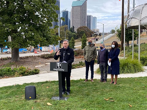 King County Executive Dow Constantine (left) and Councilmember Girmay Zahilay (second from left) announce building codes for unincorporated King County to reduce greenhouse gas emissions. (Photo: Ben Adlin)