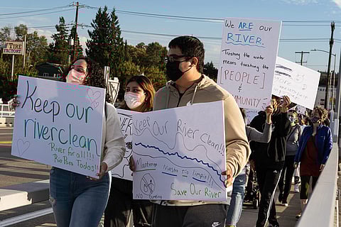 Community members chanted "Clean the river!" as they marched across the South Park Bridge during a Sept. 24 rally protesting the EPA's proposed changes to the cleanup of the Duwamish River. (Photo: Ronnie Estoque)