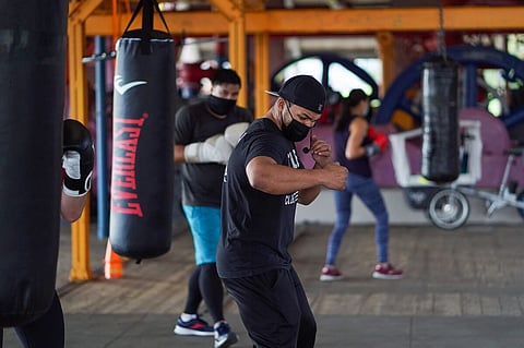 Nomad Boxing Club owner and coach Manny Dunham teaches a boxing class at Gas Works Park in March 2021. (Photo: Susan Fried)