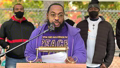 With other members of the Regional Peacekeepers Collective, Saleem Robinson, founder and executive director of Renegades for Life, discusses the coalition's public health approach that brings together a wide range of services to address the root causes of gun violence. (Photo: Malu Santos)