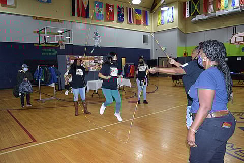 The Double Dutch Divas double Dutching at the Southwest Boys & Girls Club in White Center during their First Annual Coat and Clothes Drive on Oct. 30, 2021. (Photo: Patheresa Wells)