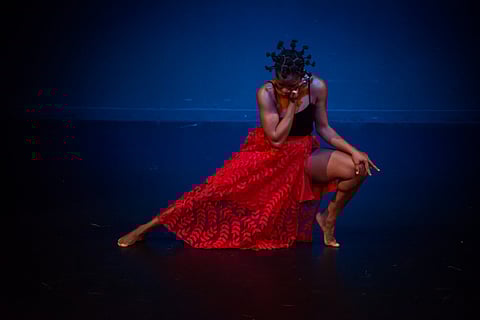 Dancer mid-performance on stage. (Photo: Erik Stuhaug, courtesy of LANGSTON, Gansango Africa Remix.)
