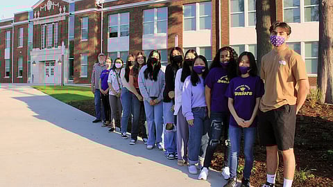 From left to right: Rod Sheffer, Executive Director, Capital Planning & Construction (1969 Highline graduate); Jodi Escareo, Sustainable Burien; Elly-Hien Trinh, Sustainable Burien; Samantha Quiroz; Jordan Powers; Gladis Gallardo; Brenda Gallardo; Selena Nguyen; Nha Khuc; Ruth Assefa; Kim Nguyen; Ricardo Gonzalez Ceja. (Photo: Rosie Eades, Highline Schools)