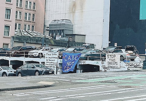Anti-sweeps signs near a tent encampment in downtown Seattle. (Photo: Erica C. Barnett)