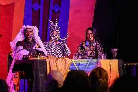 The Queens beam at the "peasants," at first hesitant in figuring out their role, but they eventually came around when they realized they could help defeat the game's monsters. (Photo: Maile Anderson)