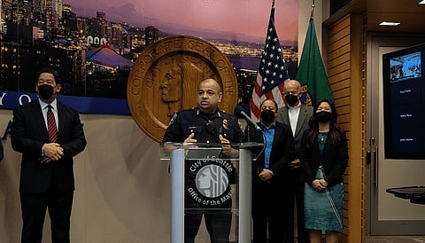 Interim police chief Adrian Diaz, flanked by Mayor Bruce Harrell and members of his administration. (Photo: Paul Kiefer)