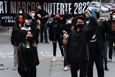 Seattle activists clad in black marched from Dr. Jos Rizal Park to protest the elections in the Philippines. (Photo: Ronnie Estoque)