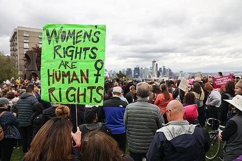 People joined Washington leaders Tuesday, May 3, 2022, to protest a draft opinion published Monday night showing the Supreme Court has voted to overturn Roe v. Wade, a ruling ensuring the right to an abortion. (Photo: Alex Garland)